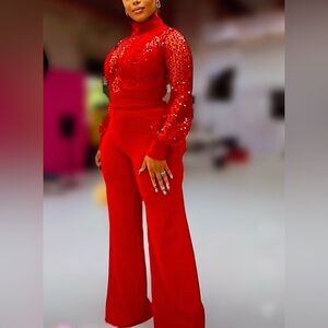 This RED Turtle Neck Long Sleeve Sparkle Jumpsuit!